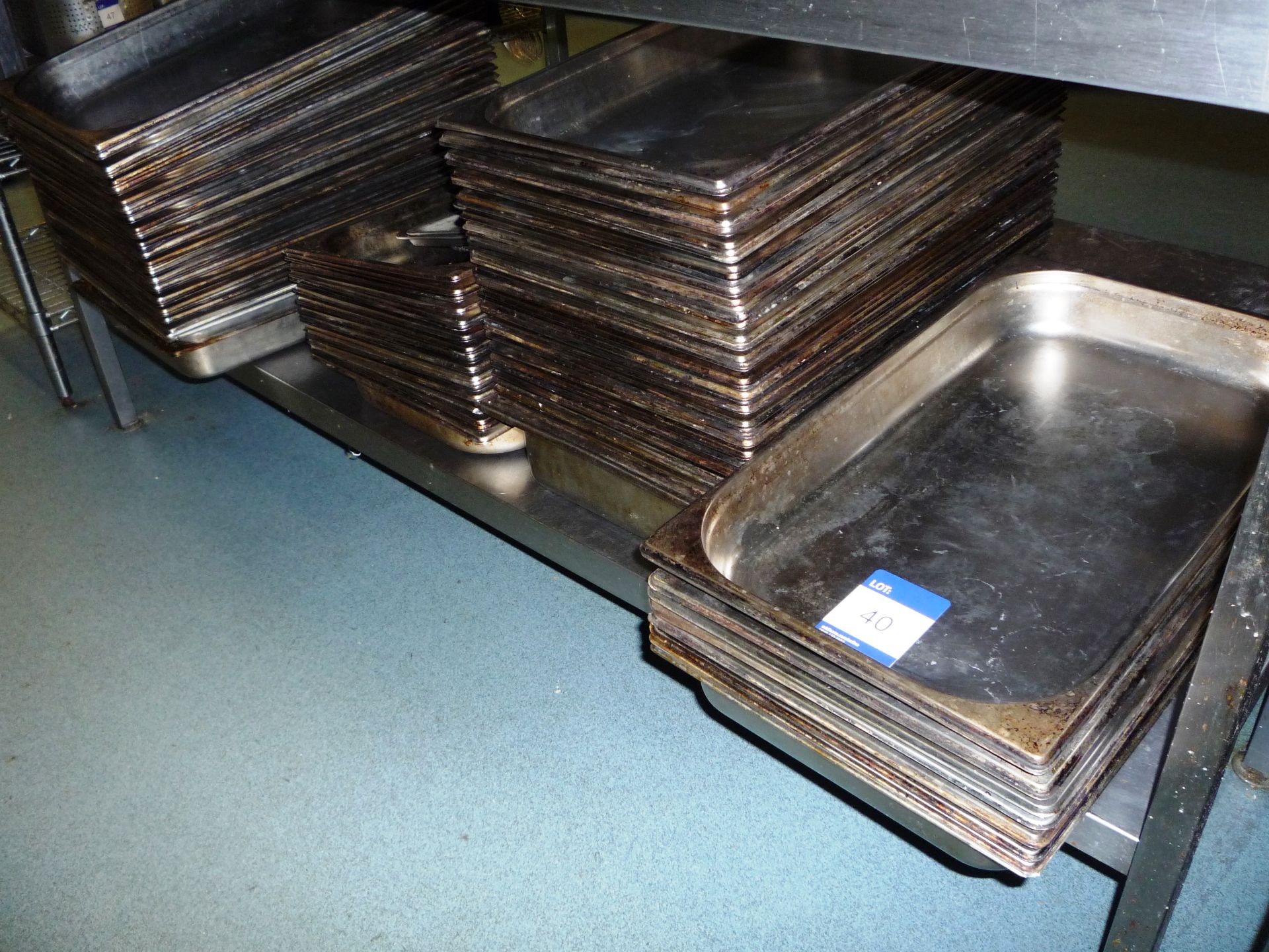 Large quantity of gastronorm trays to shelf – view