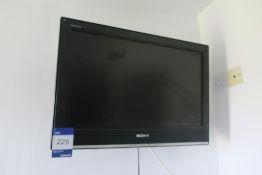 * 2 x Black and White Prints in Darkwood Frames, Sony Bravia 26'' Wall Mounted TV. This lot is