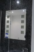 * Wall Mounted Rectangular Mirror and Illuminated Bathroom Mirror. This lot is located in Room