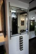 * Twisted Metal Framed Wall Mirror with Steel Paper Holder. This lot is located in Reception