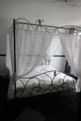 * Ornate Tubular Metal 4 Poster Kingsize Bed with Mattress and Net Curtaining. This lot is located