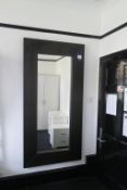 * Large Dark Oak effect Wall Mirror. This lot is located in Room 411