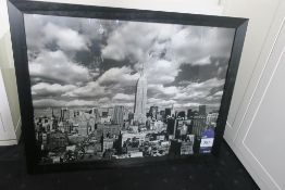 * Black and White Framed City Print in Black Frame. This lot is located in Room 411.