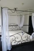 * Ornate Tubular Metal Kingsize Bed with Mattress and Net Curtaining. This lot is located in Room