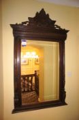 * Large Ornate Mahogany Framed Mirror to wall. This lot is located in the Stairwell