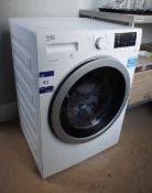 * Beko WDX8543130W Washing Machine. This lot is located in the Corridor between Restaurant and