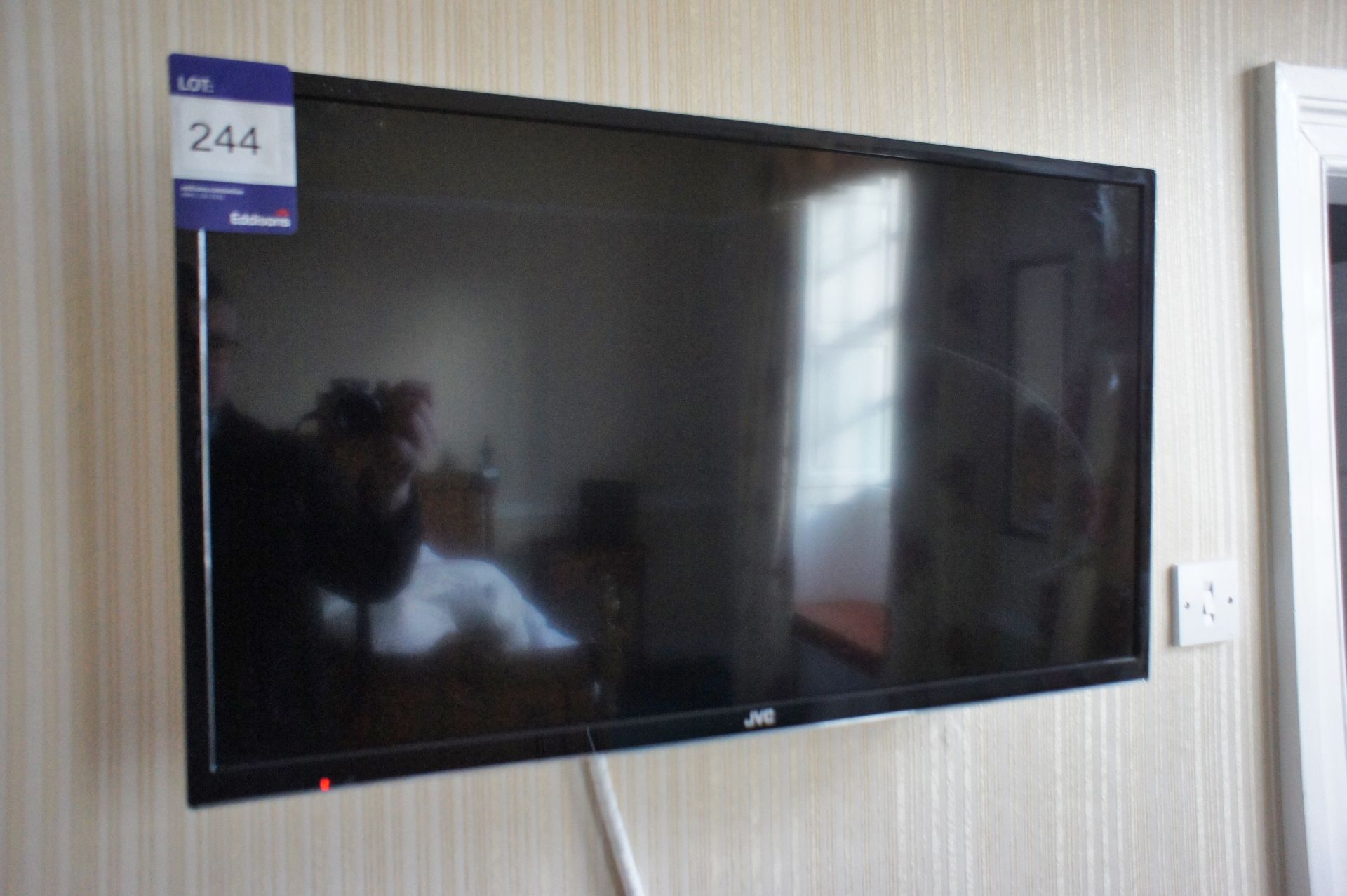 * JVC 32 inch Flat Screen TV. This lot is located in the Bedroom McMullan