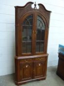 Heavily Carved Corner Display Cabinet with turned finial decoration and featuring two glass