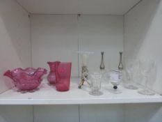 A Shelf of Glassware to include a Cranberry Glass Tumbler and two Similar Designed Cranberry Glass