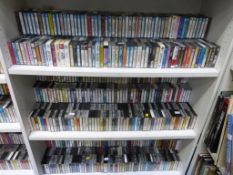 Three Shelves containing Cassettes of Various Genres. Please note the buyer must bring packing