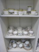Three Shelves of Three Tea Services: 'Jackson & Gosling', Floral Designed Service and an Oriental