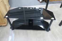 A Black Glass Two Tier TV Stand (H40cm W90cm D37.5cm) (est £20-£40)