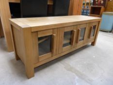 Wooden Low Sideboard with shelf behind four glass panelled doors (H 49cm, W 128cm, D 41cm) (est £