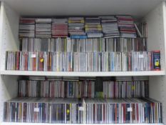 Two Shelves containing CD's of Various Genres. Please note the buyer must bring packing materials