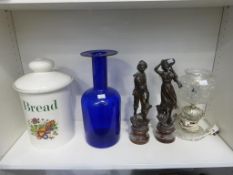 Lot to include: Large Bread Bin, Blue Glass Vase, Two Figures of a Man and Woman and a Glass Lamp (