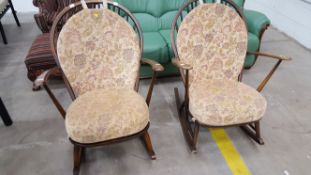 A pair of Ercol early stick back rocking chairs (est £70 -£120).