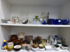 Two Shelves to include Coloured and Shaped Glassware together with Ceramics to include Denby