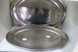 Two Shelves containing Five Stainless Steel Meat Plates/Serving Dishes together with Selection of