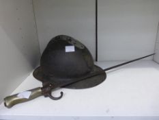 A French WWI Helmet together with a Bayonet (est £50-£100)