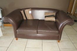 * A Large Brown Faux Leather Deep Sofa with Scatter Cushions. This lot is located at Clough Manor