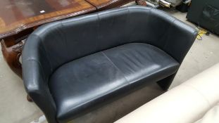 Black Leatherette Two Seater Tub Sofa together with a Circular Wooden Coffee Table (H 42cm, D