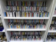 Three Shelves containing Cassettes of Various Genres. Please note the buyer must bring packing