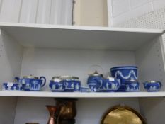 A Shelf containing Twelve Pieces of Cobalt Jasperware (eight featuring a silver plated rim/lid)