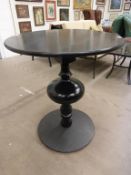Black Wooden Pedestal Table with circular top and a bulbous base (H 88cm, W 75cm, D 75cm) (est £