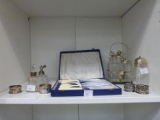 A Shelf containing Silver/Silver Plated Items including a Condiment Set, Napkin Rings (2 x Silver),