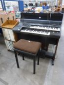 A Yamaha Electone EL-15 Organ with Stool and a quantity of Organ Sheet Music (est £100-£200)