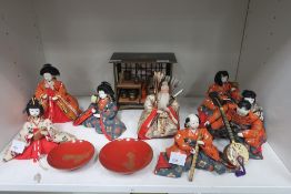 A Collection of Japanese ''Hinamatsuri'' Dolls with Silk Dresses, Glass Eyes and in Gofun. (Nine