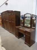 A Wooden Dressing Table with heavily carved panels featuring seven drawers (H 158cm, W 119cm, D