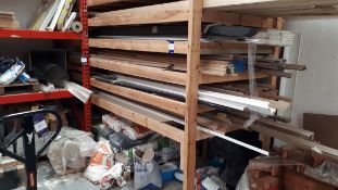 Wooden rack and contents, to include various profiles of wood, tiles, bags of cement etc