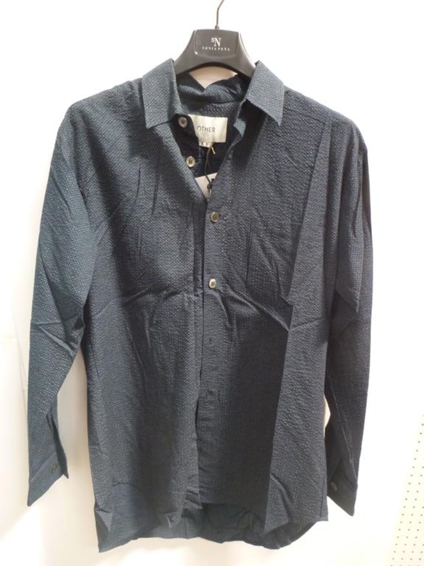 A Berthold Zip Up Top (S), a Dark Blue Long Sleeved Shirt (XS)