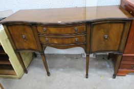 A reproduction Mahogany Serpentine fronted Sideboard