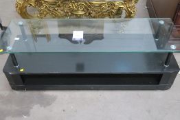 A black glass Entertainment Stand