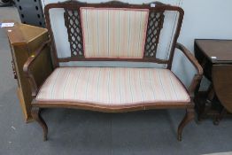 An Edwardian Mahogany frame Salon Settee