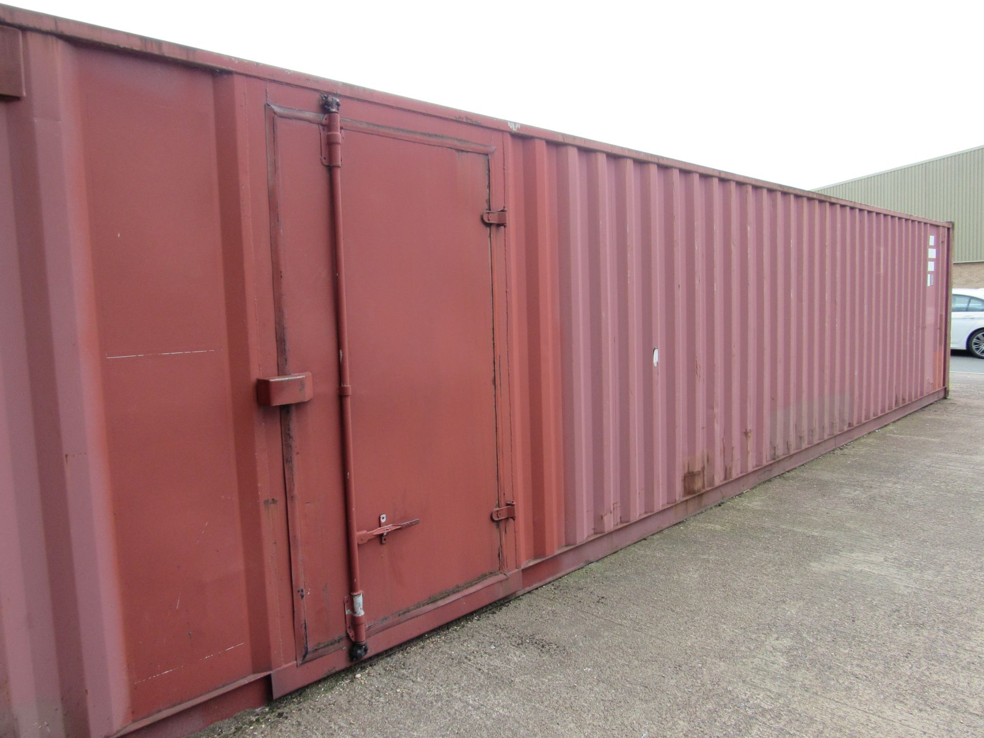 40ft Shipping Container with additional Single Leaf Door, wired for lighting, including contents ( - Image 3 of 8