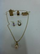 Three 9ct Gold Charms, a Pearl Pendant on a Gold C