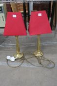 Two Brass Lamps with Red Shades