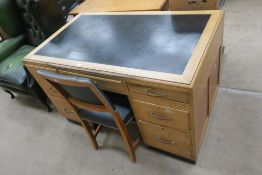 An Oak Office Desk with inset writing surfase over