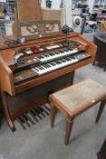 A Farfisa walnut Cased Electric Organ with Two Key