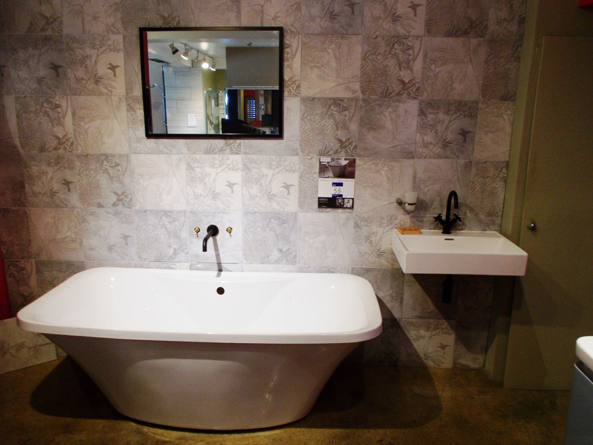 London bathroom suite, including bath with 180 litre capacity, and sink. RRP £2,000