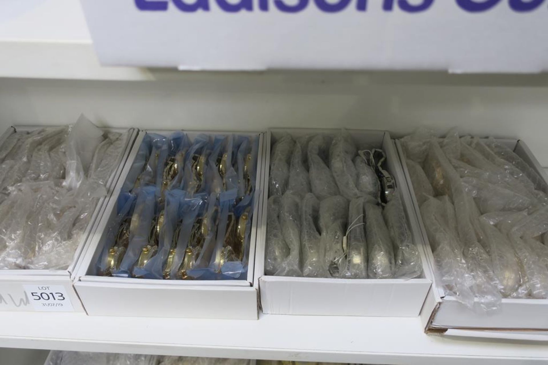 A Shelf containing over Sixty Wristwatches of assorted colours, sizes and styles