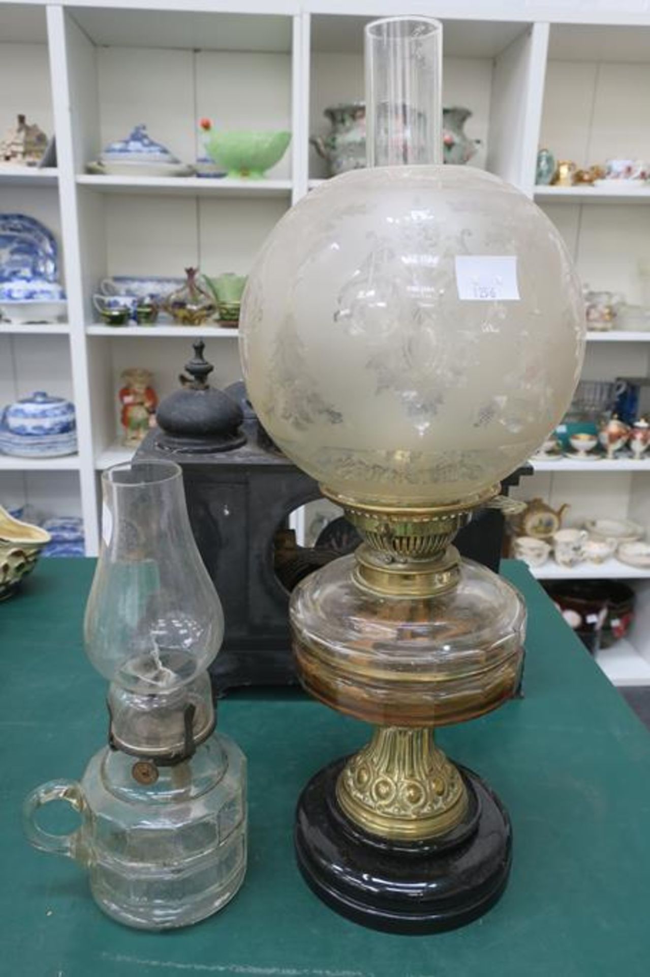 A Brass and Glass Oil Lamp with Shade and Chimney