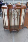A Walnut Bow Fronted Display Cabinet
