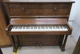 A Volknep Oak Cased Upright Piano
