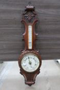 A Victorian Carved Oak Cased Aneroid Barometer wit
