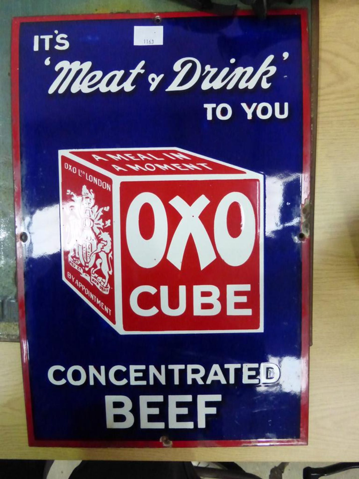 An Oxo Cube Advertising Metal Sign