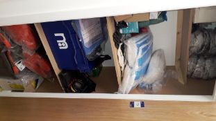 Contents of cupboard containing site safety clothing such as hard hats, asbestos coveralls, chest